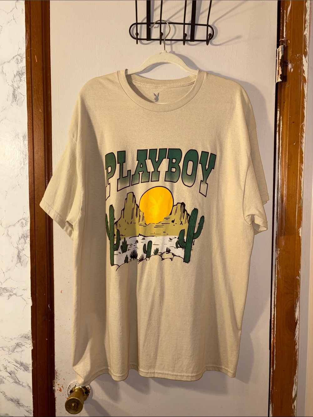 PLAYBOY Cream Short-Sleeve Tee with Green Logo and Yellow Desert Graphic